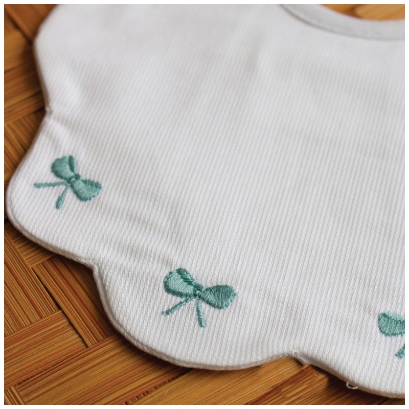 Embroidered bib in pure cotton by...