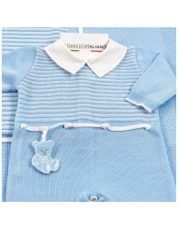 Detail of knitted newborn first outing layette set with teddy embroidery
