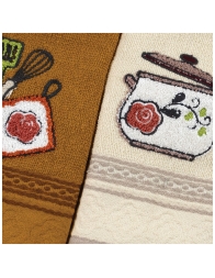 Embroidered cotton dish towels placed on kitchen table