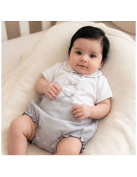 Baby girl romper in polka dot piqué cotton with pleated details