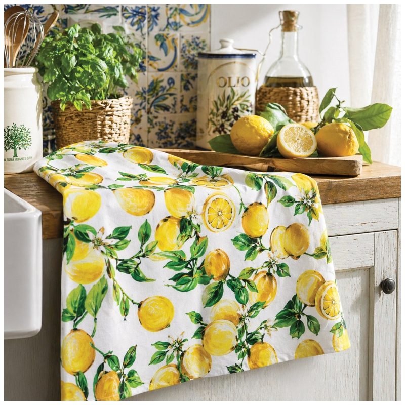 Lemon pattern kitchen towel displayed on a Mediterranean-style countertop
