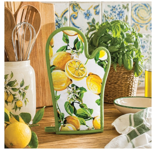 Lemon design oven glove on kitchen countertop in Mediterranean style setting with coordinated textiles