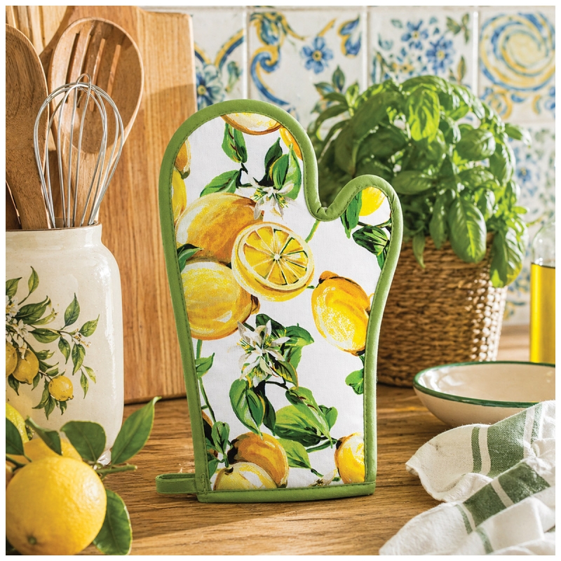 Lemon design oven glove on kitchen countertop in Mediterranean style setting with coordinated textiles