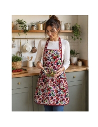 cotton kitchen apron with bib worn while cooking in home kitchen