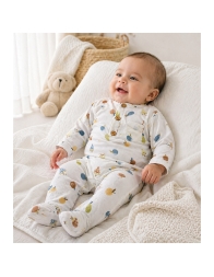 Baby at home wearing bamboo Fruttiny romper during daily rest time