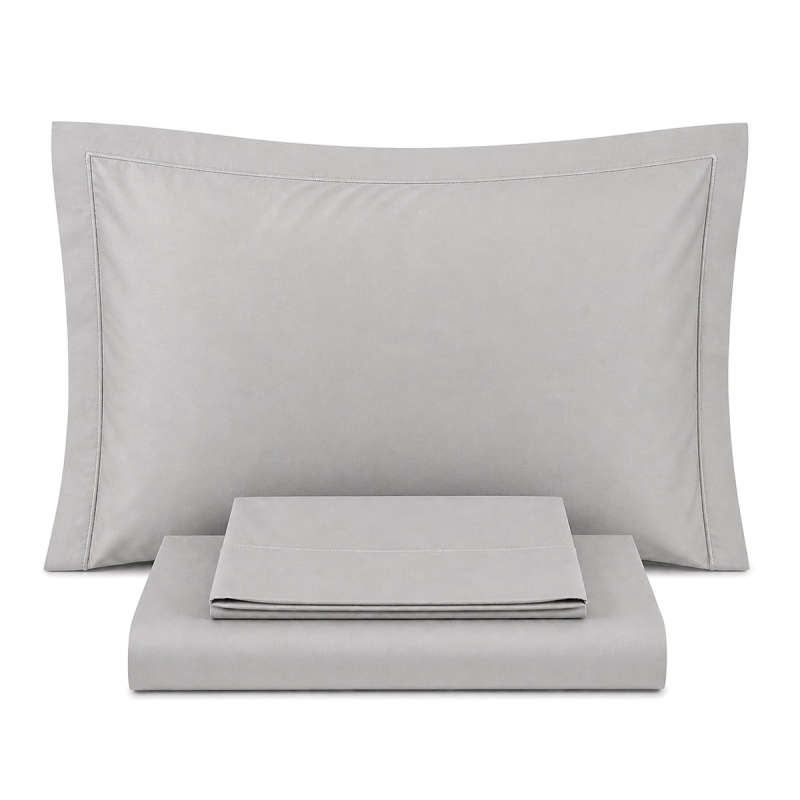 Cotton percale double bed sheet set with piping displayed on double size bed