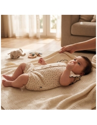 Baby girl wearing Coccode gauze romper