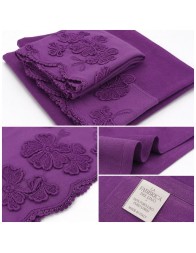 Close-up of floral appliqués on Italian crinkled linen bathroom towel