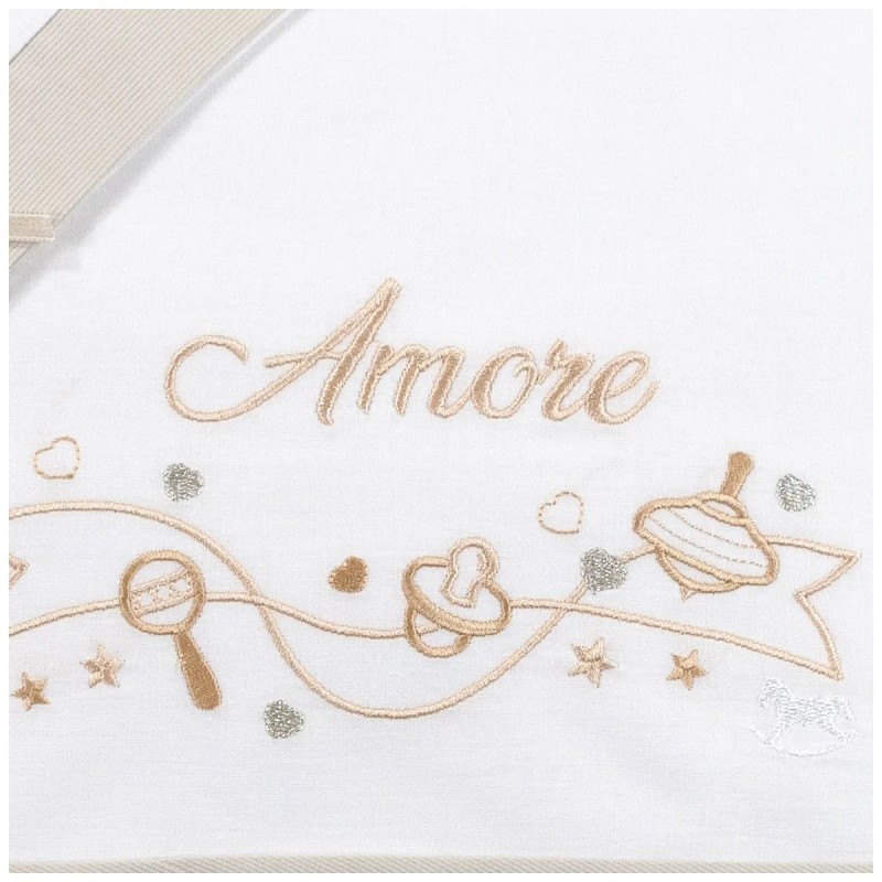 Close-up of Amore embroidery and beige piqué trim on breathable cotton baby sheet set