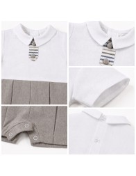 Close-up details of the baby linen and cotton romper with classic collar, stitching, back buttons and crotch opening.