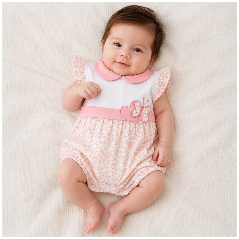 Baby girl wearing short cotton romper