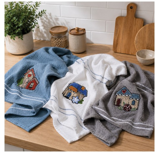 Embroidered cotton kitchen towels on modern countertop