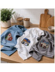 Embroidered cotton kitchen towels on modern countertop