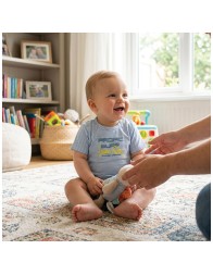 Short sleeve baby T-shirt featuring shoulder button opening and nautical striped cotton jersey fabric.