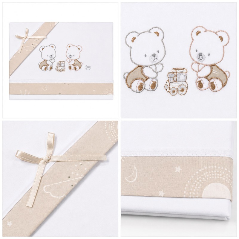 Embroidered baby cot sheet set featuring two teddy bears, a train motif and beige decorative inserts