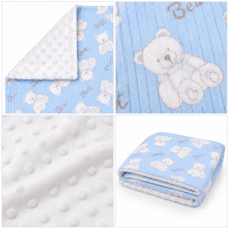 Double-sided baby crib blanket in soft pile with reversible corner