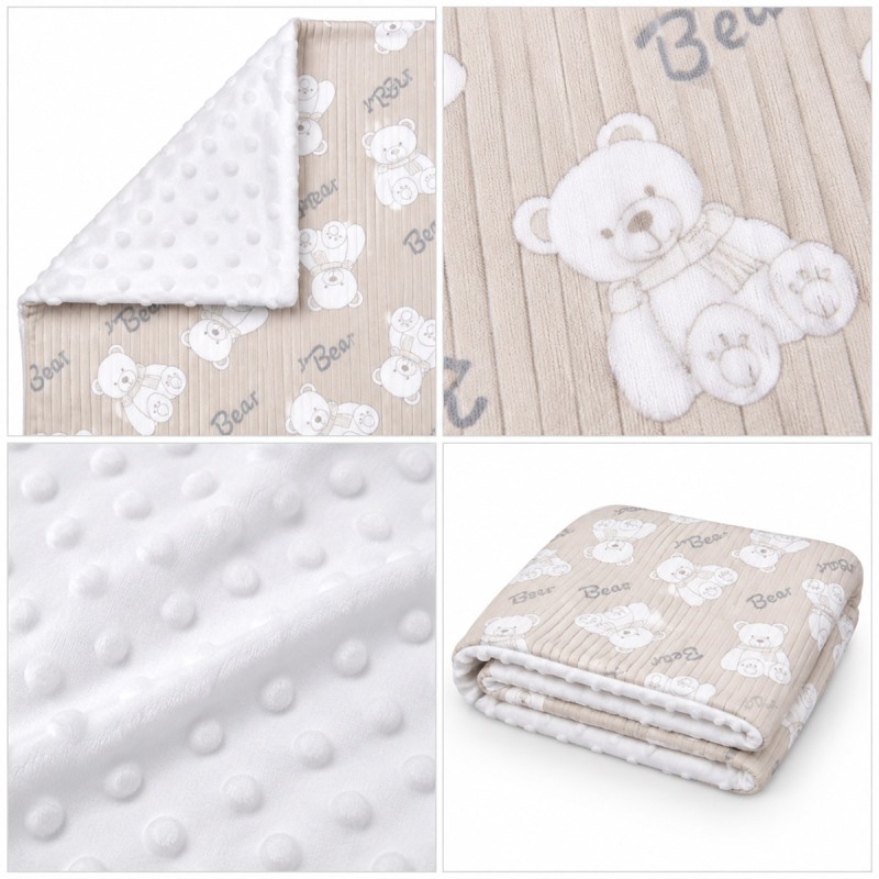 Double-sided baby crib blanket in soft pile with reversible corner