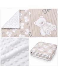 Double-sided baby crib blanket in soft pile with reversible corner