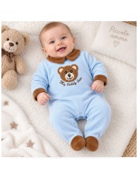 Baby velour sleepsuit in light blue worn by a 3-month-old baby, with integrated feet
