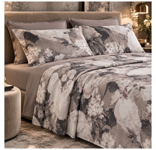 Elegant double bedroom featuring Ambra floral bedding with a plain fitted sheet