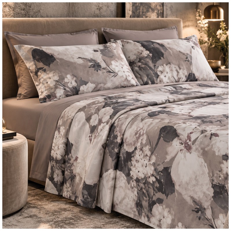 Elegant double bedroom featuring Ambra floral bedding with a plain fitted sheet