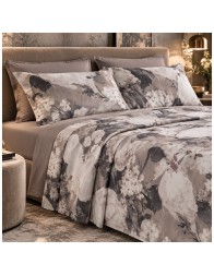 Elegant double bedroom featuring Ambra floral bedding with a plain fitted sheet