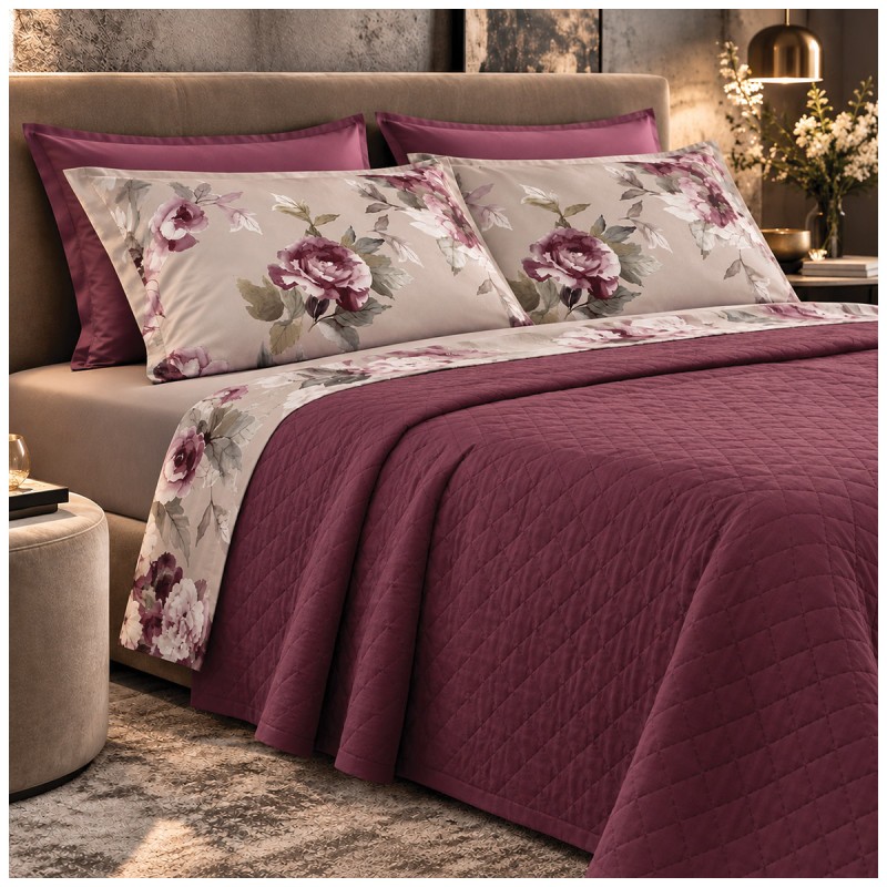 Double bed dressed with Hillary Dondi Home bedding, fitted sheet and delicate floral pattern