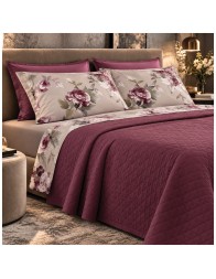 Double bed dressed with Hillary Dondi Home bedding, fitted sheet and delicate floral pattern